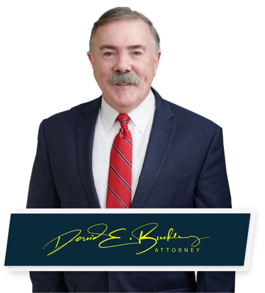 Photo of derry car accident lawyer Attorney David E Buckley posing for a headshot with his signature below