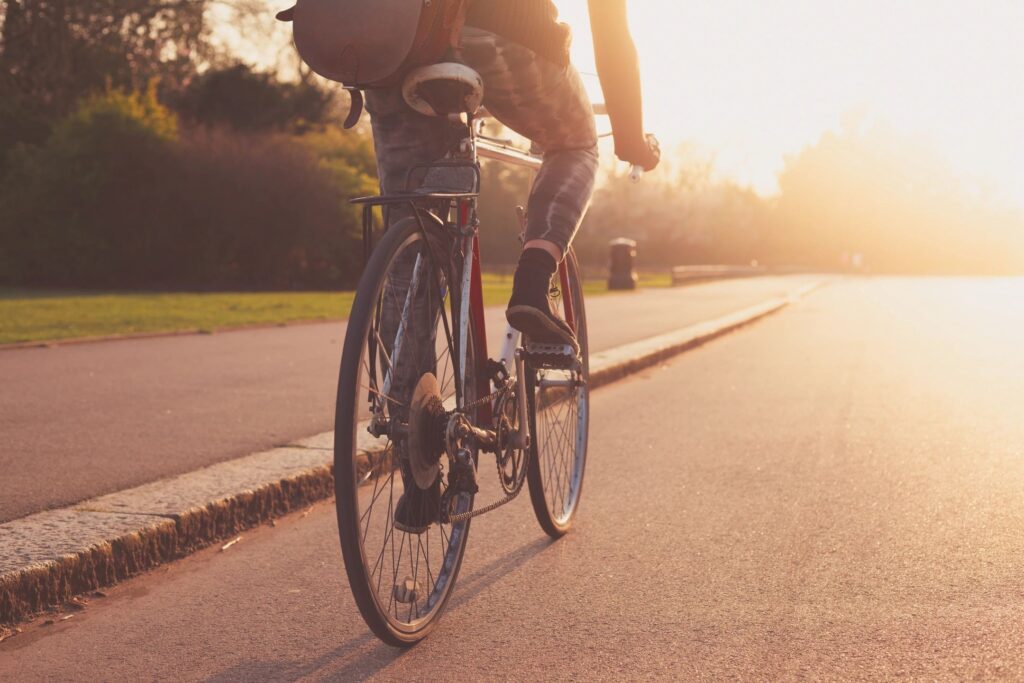 derry personal injury services law firm features a photo of a bicyclist riding legally in the road