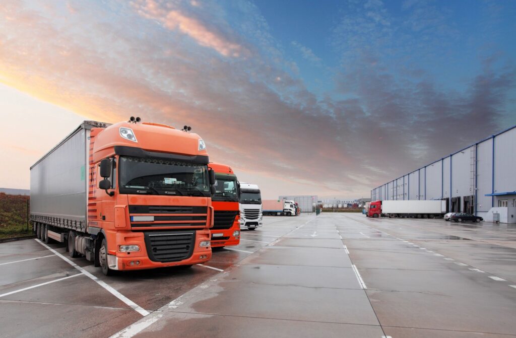 derry Truck accident lawyer features photo of trucks lined up in a parking lot